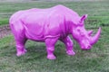 Pink plastic rhino in an amusement park