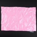 Pink plastic sheet, crumpled texture Royalty Free Stock Photo