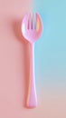 Minimalist Pink Spork on Two-Toned Background for Modern and Creative Designs Royalty Free Stock Photo
