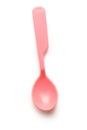Pink plastic spoon on white background Royalty Free Stock Photo