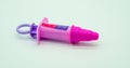 Pink plastic syringe of doctor and nurse play set Royalty Free Stock Photo