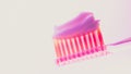 Pink plastic toothbrush with a thick layer of white toothpaste on an isolated background Royalty Free Stock Photo