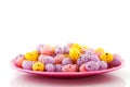 Pink plate filled with easter eggs Royalty Free Stock Photo