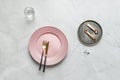 Pink plate with golden cutlery and vintage plate with measuring spoons Royalty Free Stock Photo