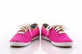 Pink polka dot canvas shoe.