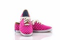 Pink polka dot canvas shoe.