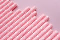 Pink polka dot paper straws on a pink background. Drinking straws, Royalty Free Stock Photo