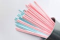 Pink polka dot paper straws and light blue polka dot paper straws on white background. Drinking straws Royalty Free Stock Photo