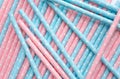 Pink polka dot paper straws and light blue polka dot paper straws on white background. Drinking straws, Royalty Free Stock Photo
