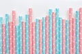 Pink polka dot paper straws and light blue polka dot paper straws on white background. Drinking straws Royalty Free Stock Photo