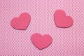 Pink polka dots background and hearts from wood Royalty Free Stock Photo