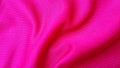 Pink polyester jersey fabric detail. Close up of pink textile with striped texture. Royalty Free Stock Photo
