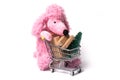 pink poodle pushing a trolley on white background - c