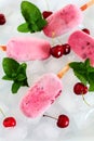 Pink Popsicles with Fruits and Mint on Ice Cubes Royalty Free Stock Photo