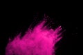 Pink powder explosion on black background. Colored cloud. Colorful dust explode. Paint Holi Royalty Free Stock Photo