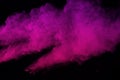 Pink powder explosion on black background. Colored cloud. Colorful dust explode. Paint Holi. Royalty Free Stock Photo