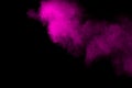 Pink powder explosion on black background.Pink dust splash cloud on dark background Royalty Free Stock Photo