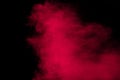 Pink powder explosion.Pink dust splash cloud on dark background Royalty Free Stock Photo