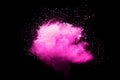Pink powder explosion.Pink dust splash cloud on dark background Royalty Free Stock Photo