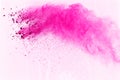 Pink powder explosion isolate on white background. Paint Holi. Royalty Free Stock Photo