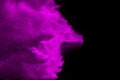 Purple powder particles splatter on black blackground. purple dust splash