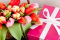 Pink present and colorful tulips festive easter decoration