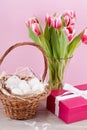 Pink present and colorful tulips festive easter decoration