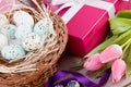 Pink present and colorful tulips festive easter decoration Royalty Free Stock Photo