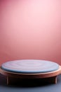 Pink product display podium for natural product. Circular shape base on a wooden stand