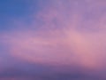 Pink and purple color clouds against blue evening sky Royalty Free Stock Photo