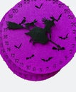 pink purple halloween clock with witches and bats isolated on white