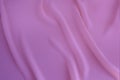 Pink, purple silk fabric, delicate satin with soft pleats for designer, text mockup, cards, luxury concept. Smooth elegant golden