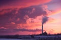 pink and purple sky with chimney towering above, surrounded by rolling clouds