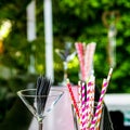 Pink and purple straws in a glass Royalty Free Stock Photo