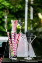 Pink and purple straws in a glass at a cocktail bar Royalty Free Stock Photo