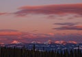 Pink and Purple Sunset Over Snowy Canadian Mountain Range