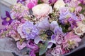 Pink purple blue wedding bouquet by florist with different flowers and roses close-up. Floral background Royalty Free Stock Photo