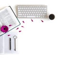 Flat lay: open Bible, keyboard, black pen, journal, notes and pink, purple, violette, red Gerbera flower with petals Royalty Free Stock Photo