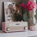 A pink radio sitting on top of a white table. AI generative image.