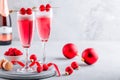 Pink Raspberry Mimosa Cocktail with champagne or prosecco