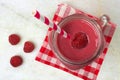 Pink raspberry smoothie in a mason jar, overhead view Royalty Free Stock Photo