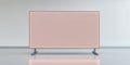 A pink rectangular display screen on metal legs in a white room with a grey floor space Royalty Free Stock Photo