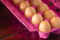 Pink box of eggs in close-up Royalty Free Stock Photo