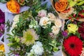 red and orange chrysanthemums, lisianthus and gerbera with green eucalyptus in a bouquet in green tones Royalty Free Stock Photo