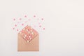 Pink, red and white sweets sugar candy hearts fly out of craft paper envelope on the white background . Valentine day concept. Gif Royalty Free Stock Photo