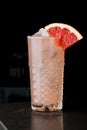 Pink refreshing drink with grapefruit in a glass of ice Royalty Free Stock Photo