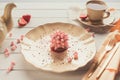 Pink restaurant dessert on porcelain plate