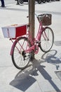 Pink retro bicycle parked on street Royalty Free Stock Photo