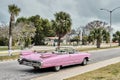 Pink retro cabriolet car taxi on street of resort town Varadero, Cuba. Royalty Free Stock Photo