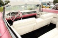 Pink retro Cadillac interior at classic car show